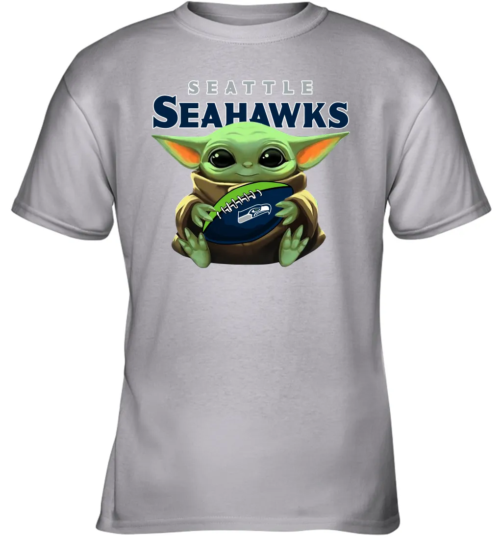 Baby Yoda Loves The Seattle Seahawks Star Wars Baby Yoda Hugs Seahawks NFL Youth T-Shirt